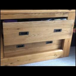 Beautiful light oak TV cabinet from Next. Solid Oak top and drawers. Really handy sliding door to access DVD etc, and two working drawers 14cm in height. Two small marks as show however overall beautiful condition. Length: 150cm, Depth: 46cm, Height: 55cm. Collection only. Cash on collection.