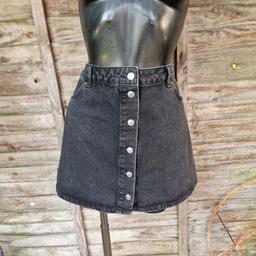 Asos design A-line denim mini skirt. Size 16. Distressed black. Button up front. Side pockets. Belt loops. 
Waist measures 32"
Length 15.5"
100% cotton