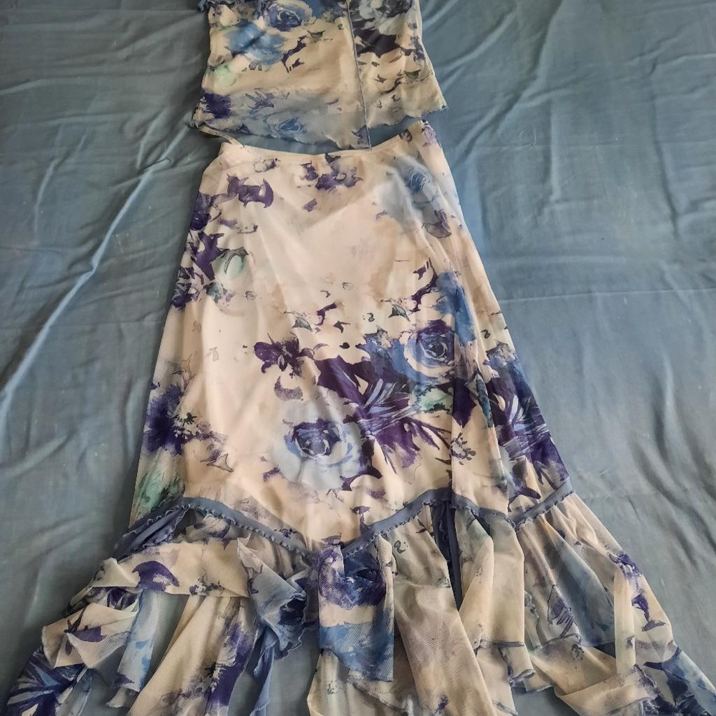 Two-piece outfit by Chianti, size 12, complete with matching fascinator. Ideal for a Summer wedding. Top and skirt both lined. Cash/collection only from Porthcawl.