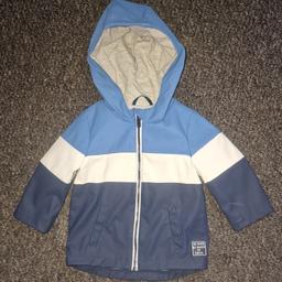 boys raincoat 
6-9months 
blue and white with hood 
brilliant condition