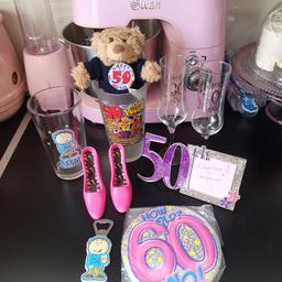 birthday bundle x 10 tems 
includes 
30th glass
40th glass
50th photo frame 
50th pint glass with teddy bear & badge
50th pint glass with bottle opener 
60th badge
shoe bottle opener 
shoe corkscrew 
Good condition 
COLLECTION ONLY