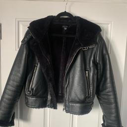 New look black aviator biker jacket faux leather with fur lining. Size small but I would think 10 to 12. Lovely jacket hardly worn