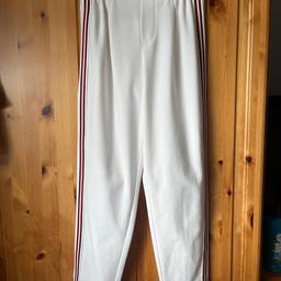 White tapered slim leg trousers with turn up Jean and side stripe, size Xtra Small by Bershka.
Worn but still in good condition.