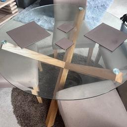 Round toughened glass table with 4 chairs , only 12 months old , hardly used . Cost £480 from Wayfair,  round carpet to match £165 for all . Excellent condition