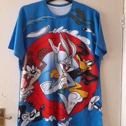 Blue background with Warner bros characters front and back. Size 5XL. All proceeds to Freddies Felines cat rescue.