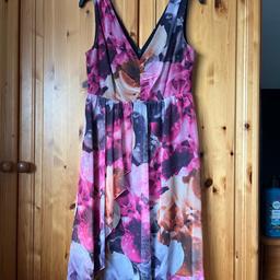 Lovely colourful mid length summer dress with v front and back and back zip, fully lined with a chiffon overlay, size 10 By Next.
Worn but still in great condition.