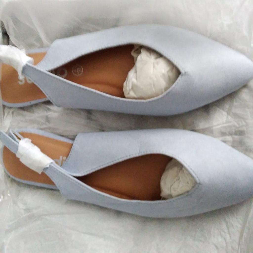 brand new blueish grey shoes. Never worn.