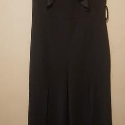 black jump suit size 8 slits up the front of the legs

no belt