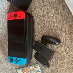 Bought new and only used a handful of times. Comes with Super Mario Wonder, Mario Kart 8 and the GTA trilogy (Vice City, San Andreas and GTA 3). Also includes the AC adapter, docking station, HDMI cable joycon controller and carrying case shown. No visible scratches. Only selling due to the fact I don’t use it.