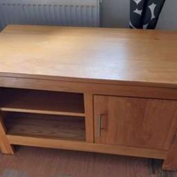 Solid oak coffee table/TV unit

Dimensions:
Length: 105cm approx
Width: 50cm approx
Height: 60cm approx from the bottom of legs
Shelf can be removed.
Good condition, small marks due to usage. There are built-in cable holes, so you can put cables and wires through the back of it.

It is EXTREMELY HEAVY, will take two people to carry it, and possibly a van or estate style car.

Collection Loughborough LE11 1 area.

Offers Welcome. Cost £589 new
Cash on collection (£50 notes will not be accepted)