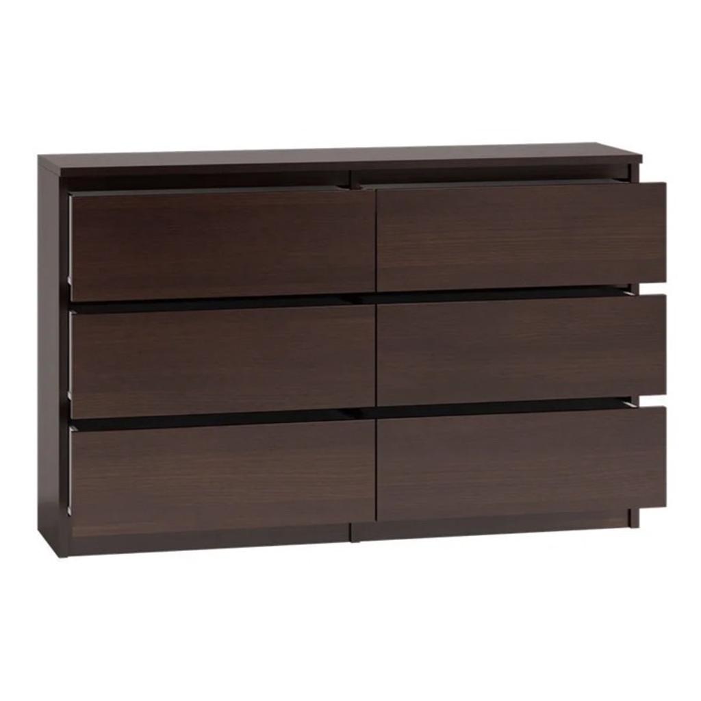 MODERNA - Chest Of Drawers And Bed Side Cabinet Range

6 DRAWER

FREE UK FAST DELIVERY

Add a touch of modern elegance to your bedroom with this stylish chest of drawers and bedside table set from The inlaid handle finish gives it a textured look, while the walnut laminate finish adds a touch of sophistication. The set comes with 2 to 10 spacious drawers, making it perfect for storing your clothes, bedding, and other essentials. Constructed with durability in mind, this MODERNA model is made in Poland and weighs between 8kg to 40kg. It's easy to assemble and is suitable for any room in your house, including the dining room, home office/study, or guestroom. Add this beautiful piece of furniture to your collection today and enjoy its timeless style for years to come.

Colours available: WENGE WALNUT