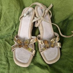 Vintage, unworn, deadstock, new with label on some. Marks and Spencer size 6/39½ espadrille wedge shoes. Beige, cream and gold. Raffia covered wedge and sides. Faux suede lightly padded insole. Canvas ankle straps with adjustable silver buckles. Criss-cross for covered in sequins and appliquéd bead and sequin butterfly. 
These shoes have been in storage for a long time and have some imperfections, visible glue, peeling inner straps, backing lifted on butterfly. 
Wedge height 3.7"