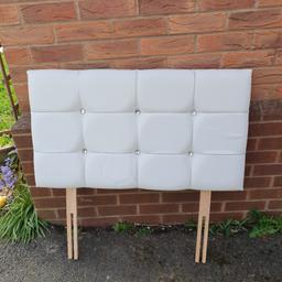 An ivory coloured, padded headboard with diamanté features. Suitable for standard size single bed. In good condition.