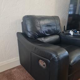 black, manual reclining armchair. Only used a few times but has minimal signs of wear and tear.