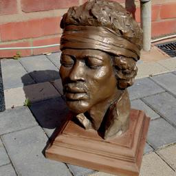 Here we have a stunning rare bust of lengendary guitarist Jimi Hendrix in his famous woodstock pose by Paul Jenkins. This is an original copy of the original bronze produced in 1994 as a limited edition. It feels like stone/bronze resin. Excellent condition, the front of the base has slightly faded with age due to being in direct sunlight for many years but not too noticable. Ref.  (#1049)

 Height........ approx  12 inch / 30 cm
 Width........  approx  7.5 inch / 19 cm 
 Length........  approx  7.5 inch / 19 cm

Pick up only, Dy4 area. Cash on collection.