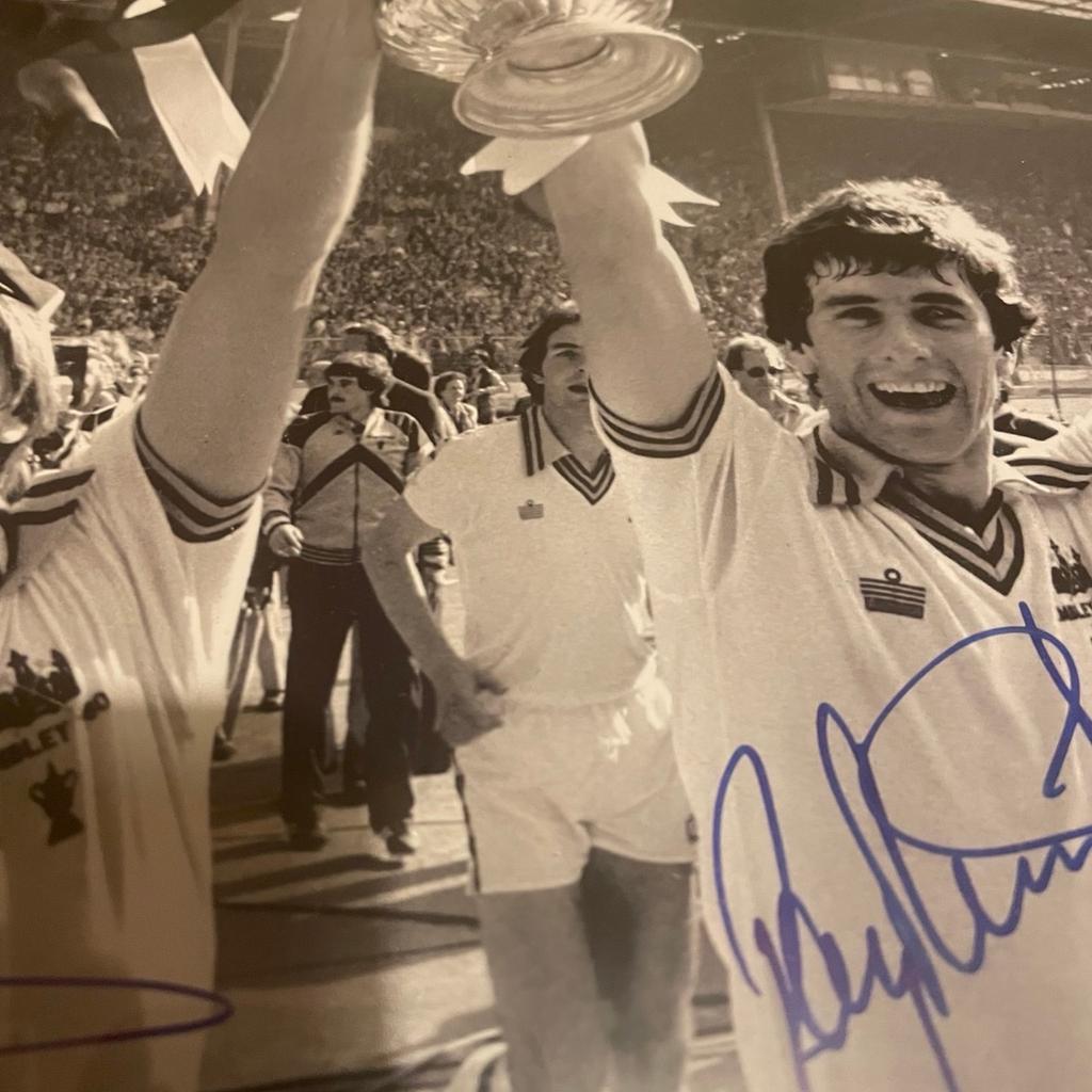 This stunning 16x12 photo captures West Ham United legends Ray Stewart and Geoff Pike in their prime, reliving their unforgettable triumph in the 1980 FA Cup Final. Hand-signed by both players, this original piece of memorabilia is a must-have for any serious football fan. Celebrate the glory days of West Ham United with this beautiful signed photo, perfect for your collection or as a unique gift for a fellow Hammers supporter.