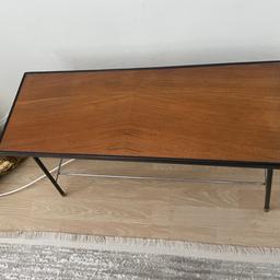 A classic and simple design dated mid 1950's.
Underneath the teak table top is a brass plated wire magazine shelving rack.

Approx 70cmx25cmx40cm

Used in excellent condition

I have 2 identical table. Price is for each one.
Collection only from WC1X