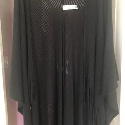 M&S BLACK PONCHO 
NEW NOT BEEN USED 
ONE SIZE 
COLLECTION ONLY 
CASH ONLY 
MONEY GOING TO DOG CHARITY