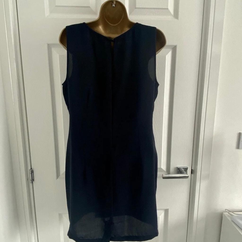 ASOS Women's Dress
Size 12
Excellent Condition
Navy Blue Colour
Round Neck
Sleeveless
Twist Drop Waist
Buttoned Keyhole Back
Concealed Back Zip
Back Split

Approx Measurements:
Front Length: 33½ inches
Armpit To Armpit: 17 inches
Waist: 34 inches
Hem: 42 inches

100% Polyester
Hand Wash

From A Smoke And Pet Free Home
Selling Due To A Massive Clear Out, Please See My Other Items As Happy To Combine Postage
All Measurements Taken With Garment Lying Flat On Floor