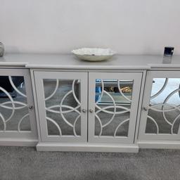 Amazing deal for Mirrored sideboard and matching coffee table set. Slightly scratched but in excellent condition. Retail price £1800 for the set. Currently Accepting £900.

Please contact me if interested, willing to negotiate price.