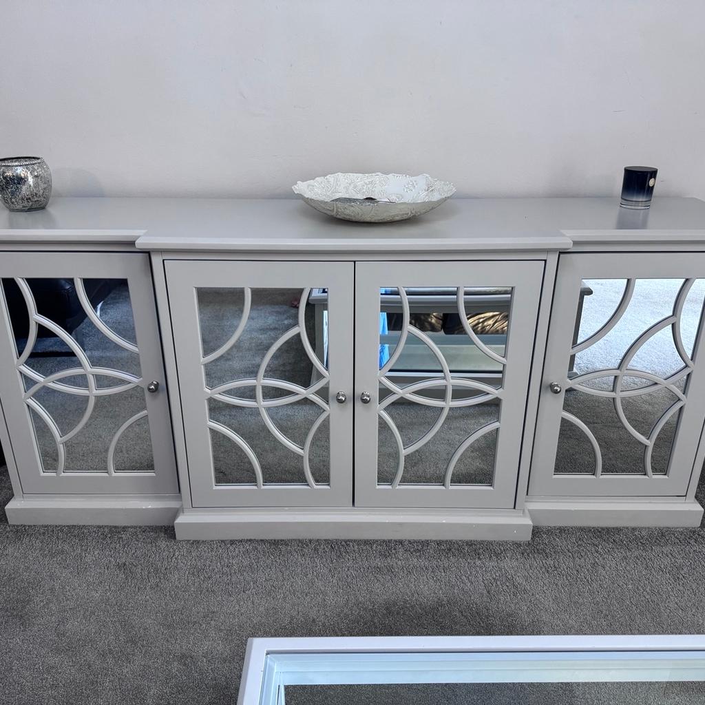 Amazing deal for Mirrored sideboard and matching coffee table set. Slightly scratched but in excellent condition. Retail price £1800 for the set. Currently Accepting £900.

Please contact me if interested, willing to negotiate price.