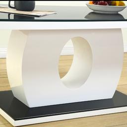 High Quality: 30mm Thick MDF Wood Top Finished in White High Gloss.

Tempered Glass: 8mm Thick Black Glass Top and Base. Easy to clean with a damp cloth.

Dimensions: Length: 120cm Width: 60cm Height: 46cm

Coffee Table for Living Room: Modern, Stylish, and Chic addition to the Living Room or Lounge of your home.