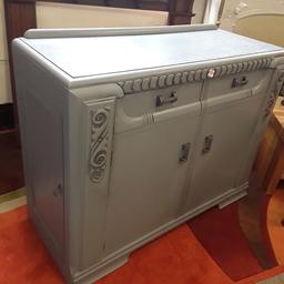 This lovely grey painted solid oak 1930's sideboard has been upcycled yet still retains its natural character and age..

4 ft long x 19 inches deep x 37 inches high.

Our second hand furniture mill shop is LOW COST MOVES, at St Paul's trading estate, Copley Mill, off Huddersfield Road, Stalybridge SK15 3DN...Delivery available for an extra charge.

There are some large metal gates next to St Paul's church... Go through them, bear immediate left and we are at the bottom of the slope, up from the red steps... 

If you are interested in this or any other item, please contact me on 07734 330574, or on the shop 0161 879 9365...Many thanks, Helen.

We are OPEN Monday to Friday from 10 am - 5 pm and Saturday 10 am -  3.30 pm.. CLOSED Sundays. CLOSED Bank Holiday long weekends...
