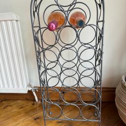 Pretty Solid Steel Wine rack. Leaf design down the sides. Top handle for easy movement. Excellent condition. Holds 18 bottles. Pick up only. No time wasters or scammers