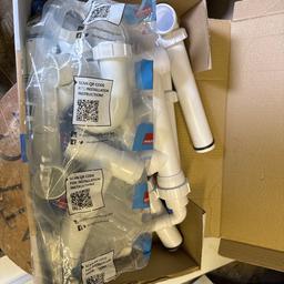 Box of under sink plumbing pipes