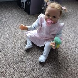 Reborn baby girl doll, cloth bodied so she can be boy or girl doll. Comes with dummy, bottle, toys and a bag of clothes. Pushchair, baby bouncer and moses basket not included. Collection or I can post at £10 p&p.