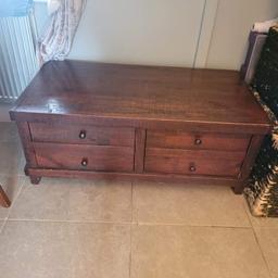 Next solid wood coffee table. It has all handles. some defects, as in there are a few chips to the corners and some cardboard on the inside of the drawer, easy to fix. Two very large drawers. Only selling as we don't have the space. it's 121cm by 63cm.