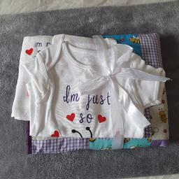 Handmade baby set 
quilt 25" x 22" slightly padded 
vest 6- 9 months 
made in smoke and pet free home 
now £7 to clear
Collect s13 Stradbroke area