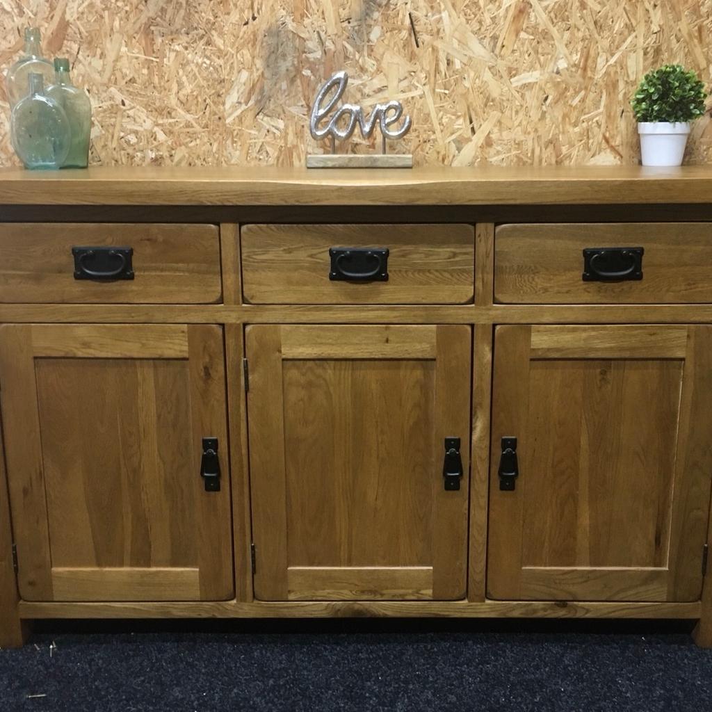 Large solid oak rustic sideboard. A really heavy piece of quality furniture built to last in great condition. The unit has 3 x solid storage drawers in the top and 3 x large cupboards in the base with a full length shelf inside. The unit measures 139cm wide x 43cm deep x 83cm tall. Viewing/collection is Leeds LS24 & delivery is available if required - £250