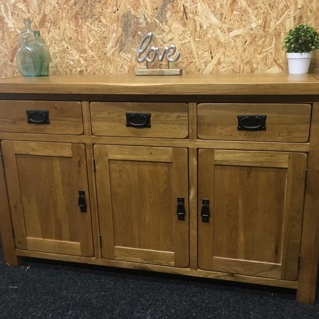 Large solid oak rustic sideboard. A really heavy piece of quality furniture built to last in great condition. The unit has 3 x solid storage drawers in the top and 3 x large cupboards in the base with a full length shelf inside. The unit measures 139cm wide x 43cm deep x 83cm tall. Viewing/collection is Leeds LS24 & delivery is available if required - £250