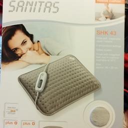 HEATED pillow still in box never used ,only opened to test working