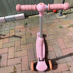 A girls scooter with lights on the wheels for sale rides perfect.