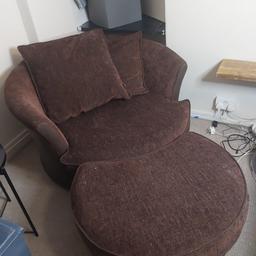 swivelling love seat with room for your loved one also has foot stool