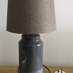 Dark grey smooth and textured pottery base.
Lighter grey shade.
60 watt maximum lightbulb. 
Height 21.5” (54.5cm)
Diameter 10” (25.5cm) at the bottom of shade.
Diameter 8” (20cm) at the top of shade.
Excellent condition.

Collection from Ramsbottom, Bury BL9 or Helmshore, Lancashire BB4.
£12.00 ono.