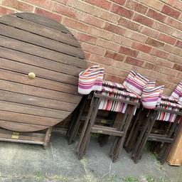 Next Wooden garden set with table, director chairs and parasol. Folds away (as in photos) for collection and easy storage for the winter. Lovely stripe design from Next. Very good condition, only used a few times and mainly been stored in garage. However, does have a few slight flaws: One seat has a catch in the material. The umbrella is a bit stiff to screw right in to the pole but you might be able to with a bit of elbow grease, and there’s a tiny mark on the table should come off (see all photos) Table diameter Approx 90cm (3 ft). Thanks for looking. CASH & COLLECTION ONLY. CRAYFORD, KENT