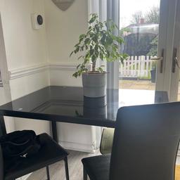 Black glass dining table with 4 chairs