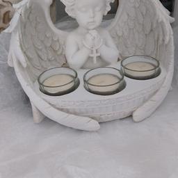 Brand New Angel that lights up and changes colour. Also is a candle holder