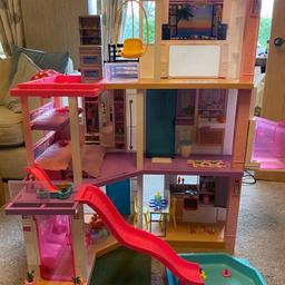 Barbie day to night dreamhouse. 
Lots of accessories included, all lights and sounds in full working order. 
Some sun fading to the plastic frame, otherwise excellent condition