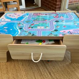 Beige toddler play table with draw. No marks on the wooden frame. The top can be removed and it’s white on the other site. 
106cm (41.5inch) x 63cm deep (25inch) x 40cm height (16inch). 
Would fit in a car