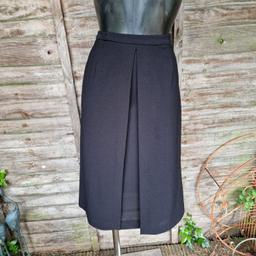 Vintage 1990s After Eight Dorothy Perkins A-line midi skirt. Textured black fabric. Pencil skirt underneath with open front top layer. High waisted. Zip and hook fastening side. Some stretch
Label says size 12
Waist measures 28" -30"
Length 27.6"
Polyester 
Made in Great Britain 
There are a few minor marks...see pics