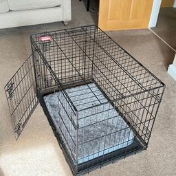 I’m selling a Kong Dog Crate. The crate measures 90cm x 57cm x 62 cm. It has two doors, one at the end and one at the side. It also has a spare end panel so the door can be removed if required. The crate has a solid base with a cushion that sits on top of jt. The crate is also collapsible and folds flat for easy transportation and storage.