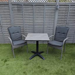 Jutlandia Garden Bistro Grey Table and 2 Chairs with removable padded cushions.

Chair size width: 57 cm, Height: 94 cm, Depth: 63 cm
Seat height	45
Chair armrest height	65 cm

Table size width: 70 cm, Length: 70 cm, Height: 72 cm
Table height - floor to lowest edge of frame	69 cm

In excellent condition. As new.

Collection only please.

Thanks.