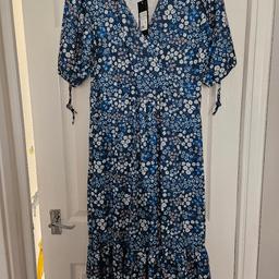 Maxi wrap summer dress
 (Cameo Rose) blue with flower design. Size 12. polyester + stretchy material.  puffed short sleeves with a tie string. 
with labels. never worn. 
buyer collects or could deliver if local.
