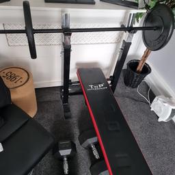 Good condition home bench and two 20 kg weights plus bar