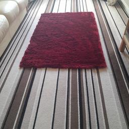 Red fluffy rug good condition Smoke and pet free home size 150cm by 100cm collection  only