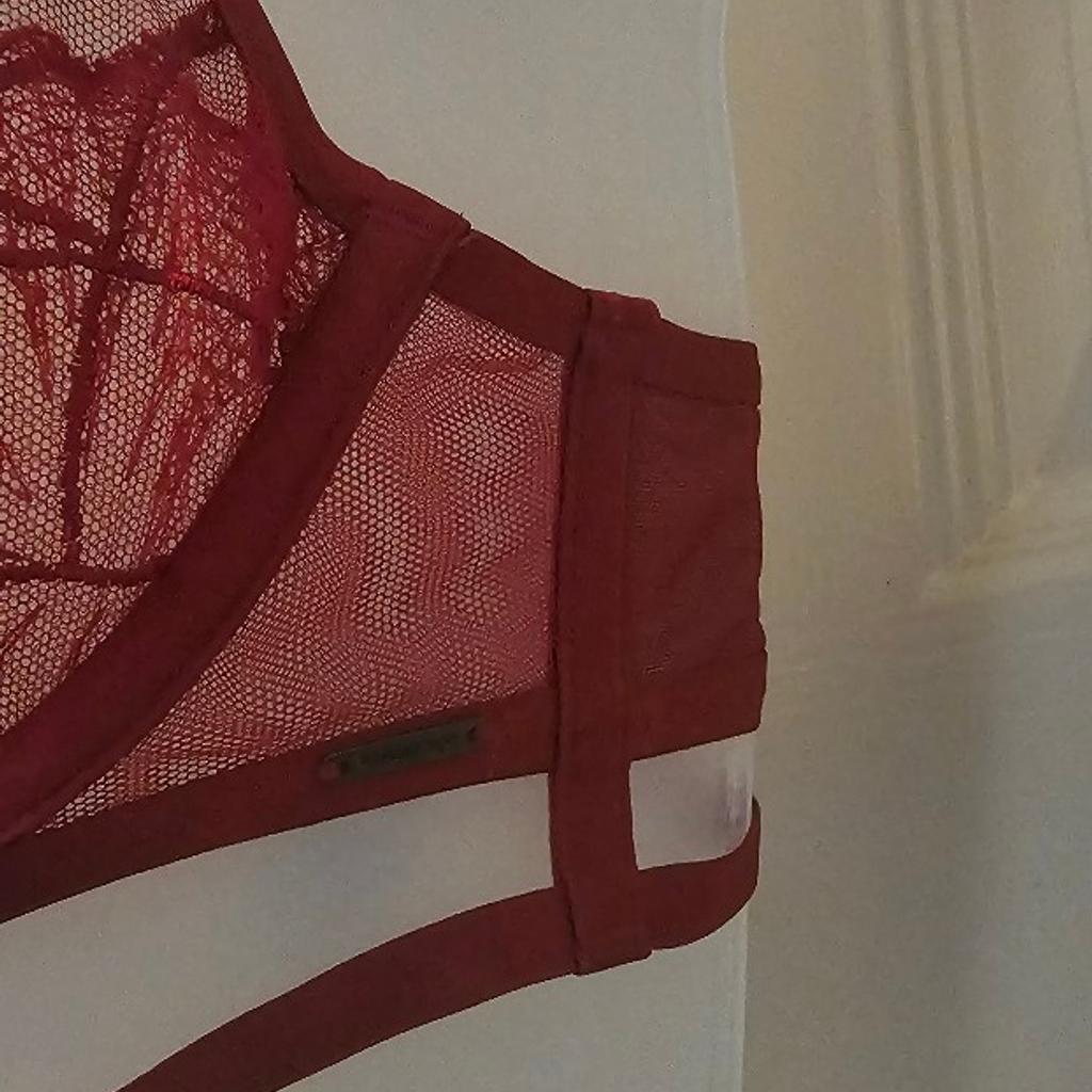 New tagged red .marks n spencers autograph bra. underwired seethrou cups adjustable straps. size 34b. collection ip3 or posting at your cost. no offers